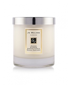 The scent of clementine leaves in the morning dew sparkles above a heart of orange blossom and water lily, transporting the wearer to a garden oasis. The Orange Blossom Home Candle infuses any room with evocative scent and lasts for hours. An everyday luxury, it brings warmth to any environment. 200g. The scent of clementine leaves in the morning dew sparkles above a heart of orange blossom and water lily, transporting the wearer to a garden oasis. The Orange Blossom Home Candle infuses any room with evocative scent and lasts for hours. An everyday luxury, it brings warmth to any environment. 200g.