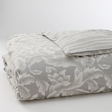 Shimmering in a platinum floral print, this comforter adds a touch of refined charm to your bedroom. Features a striped print on reverse. Shimmering in a platinum floral print, this comforter adds a touch of refined charm to your bedroom. Features a striped print on reverse.