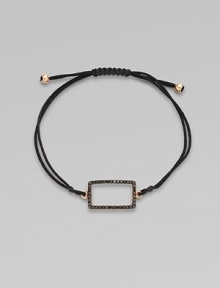 A knotted cord with a black diamond encrusted, 18K rose gold, rectangular link. Black diamonds, .28 tcw18K rose goldPolyester cordLink size, about ¾Length, about 13½ adjustableDrawstring closureImported 