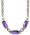 Purple perfection. A lovely lavender hue stands out stylishly on this chic collar necklace from Jones New York. Crafted in silver tone mixed metal, it's embellished with acrylic accents. Approximate length: 16 inches.