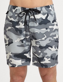 Spend countless hours in the sun, the beach and beyond in these quick-drying nylon swim trunks, tailor made for a serious summer style statement.Drawstring tie waistBack flap pocketInseam, about 7Nylon polyamideMachine washImported Spend countless hours in the sun, the beach and beyond in these quick-drying nylon swim trunks, tailor made for a serious summer style statement.Drawstring tie waistBack flap pocketInseam, about 7Nylon polyamideMachine washImported