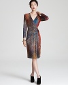 A color-infused tweed print adorns this day-perfect Escada faux wrap dress.