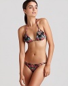 Mara Hoffman's lotus-printed bikini is a must for the style-setter turned sunbather. Wear this ultra-flattering halterneck with your favorite frames to be splashy-chic.