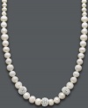 Elegance and sparkle combine. Cultured freshwater pearls (6-8 mm) and three crystal-accented balls shimmer and shine on this stunning strand necklace. Set in sterling silver. Approximate length: 18 inches.