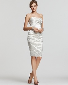 Nicole Miller's dashing strapless dress boasts a subtle metallic sheen and crinkled effect that will have you glowing all night long. Nicole Miller's dashing strapless dress boasts a subtle metallic sheen and crinkled effect that will have you glowing all night long.