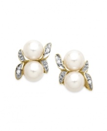 A natural choice. These earrings, crafted from 10k gold, exudes elegance with cultured freshwater pearls (5 mm) and diamond accents along a whimsical leaf motif. Approximate drop: 5/8 inch. Approximate width: 1/3 inch A natural choice. These earrings, crafted from 10k gold, exudes elegance with cultured freshwater pearls (5 mm) and diamond accents along a whimsical leaf motif. Approximate drop: 5/8 inch. Approximate width: 1/3 inch