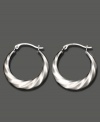 Shining swirls add dimension and texture to these 14k white gold hoop earrings. Approximate diameter: 1/2 inch.