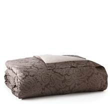 Egyptian cotton is woven in Italy into a serene and sweet sateen jacquard. Large scrolls play across the shining surface of the duvet covers and shams, each finished with a plain hem and decorated with a subtle flange.The duvet covers are backed in a plain sateen while the shams feature the jacquard pattern on the front and back. Egyptian cotton is woven in Italy into a serene and sweet sateen jacquard. Large scrolls play across the shining surface of the duvet covers and shams, each finished with a plain hem and decorated with a subtle flange.The duvet covers are backed in a plain sateen while the shams feature the jacquard pattern on the front and back.