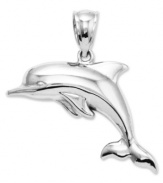 This puffed charm commemorates everyone's favorite porpoise! Crafted in 14k white gold, this polished dolphin charm features a unique 3-dimensional design. Approximate length: 1-1/10 inches. Approximate width: 8/10 inch.