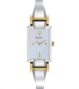 Accessorize with radiance. Brilliant watch by Bulova crafted of two-tone stainless steel bangle bracelet and rectangular case. White mother-of-pearl dial features applied gold tone stick indices at three, six and nine o'clock, logo at twelve o'clock and two hands. Quartz movement. Water resistant to 30 meters. Three-year limited warranty.