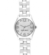 A clean and classic design with a charming twist, by Nine West. Watch crafted of silver tone mixed metal bracelet and round case. Silver tone dial features applied numerals, hour and minute hands, sweeping second hand and logo at six o'clock. Quartz movement. Limited lifetime warranty.
