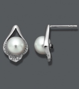 Define your style with subtle studs. Crafted in sterling silver, these petite, cultured freshwater pearls (7-8 mm) shine in a diamond-accented, sterling silver teardrop setting. Approximate diameter: 1/2 inch.