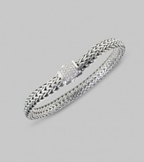 Substantial sterling links are accented with a clasp of delicate pavé diamonds. Diamond, 0.17 tcw Sterling silver 7½ long Spring lock closure Made in Bali