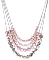 Lovely in lilac! Pastel purple hues combine with shimmering silvery tones on this multi row necklace from Kenneth Cole York. Adorned with imitation pearls and faceted glass beads, it's crafted in hematite tone mixed metal. Approximate length: 16 inches + 3-inch extender.