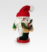 White-clad Father Christmas nutcracker is entirely hand-crafted in Germany, wearing a red knit hat and carrying a velvet stocking filled with gifts.6½ X 6 X 11HCarved woodMade in Germany