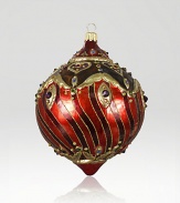 The Heritage of Jay Strongwater began as the bejeweled frame with beautiful stone settings and scrolls, becoming the source of inspiration for this season's new glass ornament collection. This ornament is mouth blown and decorated in Poland with a wonderful team of old world craftsmen. Detailed with crystals, hand applied jewel tone colors and scrolls as if it were a fine piece of jewelry.GlassCrystalMouth blownHand-painted and hand-set5.5H X 3.75W X 4DImported