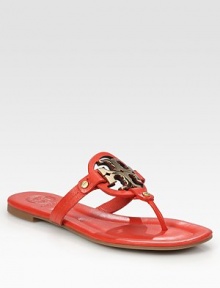 Smooth leather thong has goldtone hardware, an oversized logo adornment and a rubber sole. Leather upperLeather liningRubber solePadded insoleImportedOUR FIT MODEL RECOMMENDS ordering true size. Smooth leather thong has goldtone hardware, an oversized logo adornment and a rubber sole. Leather upperLeather liningRubber solePadded insoleImportedOUR FIT MODEL RECOMMENDS ordering true size.