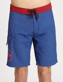 Contrasting waistband adds a splash of color to this all-time beach favorite.Drawstring tie waistSide cargo pocketInseam, about 9NylonMachine washImported Contrasting waistband adds a splash of color to this all-time beach favorite.Drawstring tie waistSide cargo pocketInseam, about 9NylonMachine washImported