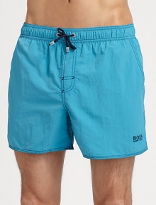 With stitched details and a grip-tape back patch pocket, these stylish swim trunks are both sporty and functional.Elastic drawstring waistStitch detail at flySlash side pocketsBack grip-tape patch pocketMesh liningPolyamidePolyester liningMachine washImported