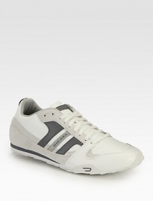 A high-performance sneaker with signature style, this lace-up constructed from leather and suede highlights impeccable stitching and a durable rubber sole, ensuring you'll stay on the right track of comfort and style .Leather/suede upperPadded insoleRubber soleImported A high-performance sneaker with signature style, this lace-up constructed from leather and suede highlights impeccable stitching and a durable rubber sole, ensuring you'll stay on the right track of comfort and style .Leather/suede upperPadded insoleRubber soleImported