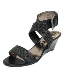 Fabric and leather intertwine to create the stylish Erica sandal by DKNYC. A big ankle buckle adds a dramatic flair. Fabric and leather intertwine to create the stylish Erica sandal by DKNYC. A big ankle buckle adds a dramatic flair.