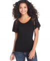 Casual style gets decidedly feminine in Cha Cha Vente's fitted top, complete with lace sleeves.