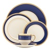 Inspired by privately commissioned presidential dinnerware, this fine china features stately navy bands and a gold border etched with patriotic stars.