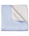 A polka dot pocket square adds a splash of luxury in supremely soft silk.