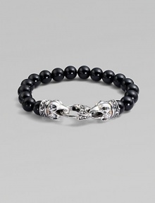 A strand of smooth black onyx beads, capped by dramatic carved raven's heads of sterling silver, clutching the clasp in their beaks. Black onyx Sterling silver Length, about 9¼ Lobster clasp Imported A strand of smooth black onyx beads, capped by dramatic carved raven's heads of sterling silver, clutching the clasp in their beaks. Black onyx Sterling silver Length, about 9¼ Lobster clasp Imported