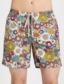 Be ready to hit the beach and beyond in these classic, tailored swim trunks, set in quick-drying, liberty art fabric.Elastic drawstring waistZip flySide slash, back welt pocketsFully linedInseam, about 7NylonMachine washImported Be ready to hit the beach and beyond in these classic, tailored swim trunks, set in quick-drying, liberty art fabric.Elastic drawstring waistZip flySide slash, back welt pocketsFully linedInseam, about 7NylonMachine washImported
