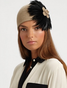 This wool-blend knit topper with large feather design is reminiscent of old Hollywood style.Pull-on style with concealed elastic band80% wool/20% polyesterDo not washImported