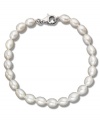 As necessary as a little black dress. This simple sterling silver bracelet features oblong cultured freshwater pearls (6-7 mm). Approximate length: 8 inches.