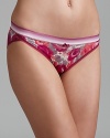 A floral print in rich autumn colors decorate a stretchy bikini from Calvin Klein.