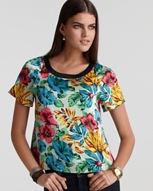 Enliven your wardrobe in this MARC BY MARC JACOBS top, flaunting a vibrant floral print and snap closures through the back for a tropical chic look. Enliven your wardrobe in this MARC BY MARC JACOBS top, flaunting a vibrant floral print and snap closures through the back for a tropical chic look.