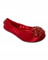 Prettier than your average shoe. The Celsey ballet flats by Nine West feature a rhinestone emblem across the vamp.