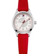 Creative and contemporary, this watch by Tommy Hilfiger keeps things interesting. Red textured silicone strap and round stainless steel case. Double-layered white and silver tone dial features cut-out numerals, red minute track, flag logo at twelve o'clock and three hands with red accents. Quartz movement. Water resistant to 30 meters. Ten-year limited warranty.