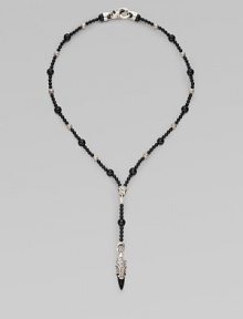 A handsomely crafted sterling silver pendant hangs from a strand of onyx beads. Sterling silver Onxy Pendant, about 1½ long Necklace, about 22 long Imported A handsomely crafted sterling silver pendant hangs from a strand of onyx beads. Sterling silver Onxy Pendant, about 1½ long Necklace, about 22 long Imported