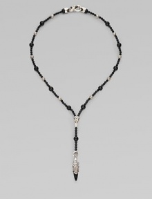 A handsomely crafted sterling silver pendant hangs from a strand of onyx beads. Sterling silver Onxy Pendant, about 1½ long Necklace, about 22 long Imported 