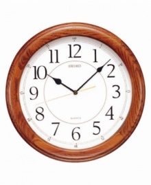This handsome wall clock from Seiko features a beautiful solid oak case. Round white dial with logo, numeral indices and quiet sweep second hand. One AA battery included. Measures approximately 13 inches in diameter and 1-1/2 inches deep. This handsome wall clock from Seiko features a beautiful solid oak case. Round white dial with logo, numeral indices and quiet sweep second hand. One AA battery included. Measures approximately 13 inches in diameter and 1-1/2 inches deep.