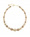 A gorgeous array of brown-hued graduated imitation pearls adorn this lovely, ladylike necklace from Charter Club. Crafted in gold tone mixed metal. Approximate length: 16 inches + 2-inch extender.