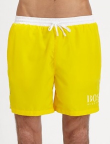 These solid swim trunks sport a drawstring waistband and the classic BOSS logo.Elastic drawstring waistSide slash pocketsPolyester liningPolyamideMachine washImported These solid swim trunks sport a drawstring waistband and the classic BOSS logo.Elastic drawstring waistSide slash pocketsPolyester liningPolyamideMachine washImported