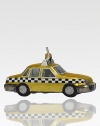 Although the real checker cabs no longer roam the city streets, this sparkling ornament recalls the heyday of these roomy roadsters, crafted of delicate glass with glitter wheels.Handmade and hand-paintedGlassAbout 5L X 2.75H X 2DImported