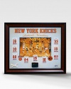 This gorgeous retired-numbers collage is a must have for any New York Knicks fan. This handsomely framed collage features a rare photograph of every Knick legend, a replica of their retired-number banner and a piece of authentic game-used cort and net. A must-have for any Knicks fan.Includes piece of game-used court, net and certificate of authenticity 35W X 30H Made in USA 