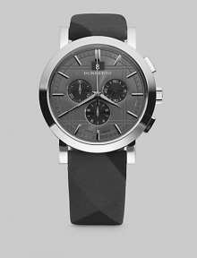 A sleek, check-engraved design on a fabric strap with three-eye chronograph movement. Stainless steel case, 44mm Fabric strap, 22mm Analog movement Date display at 12 o'clock Second hand Imported 