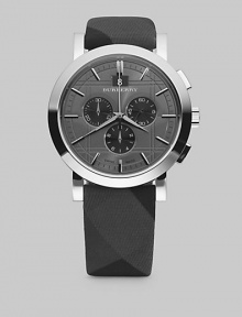 A sleek, check-engraved design on a fabric strap with three-eye chronograph movement. Stainless steel case, 44mm Fabric strap, 22mm Analog movement Date display at 12 o'clock Second hand Imported A sleek, check-engraved design on a fabric strap with three-eye chronograph movement. Stainless steel case, 44mm Fabric strap, 22mm Analog movement Date display at 12 o'clock Second hand Imported