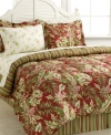 Reminiscent of an island paradise, this Exotic Floral bedding ensemble boasts a bold print of tropical leaves and flowers in a rich green and red palette. Comforter reverses to a chic stripe design that matches with the accompanying bedskirt. Comes complete with coordinating sheet set for a completely restful retreat in your room.