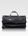 This roomy wheeled duffel is ideal for recreational and adventure travelers, whether traveling alone or as a pair. The durable ballistic nylon design features a separate bottom section perfect for gear, boots, shoes or clothing you want to keep separate. Zip closure Carry handles and telescoping handle Exterior zip pockets Interior organizing pockets FXT ballistic nylon 15½W X 29H X 14D Imported 