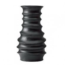 Hand-carved from a single piece of mango wood, this sensually rippled vase is crafted from a renewable, sustainable resource for the ultimate in natural beauty. Hand-carved from a single piece of mango wood, this sensually rippled vase is crafted from a renewable, sustainable resource for the ultimate in natural beauty.