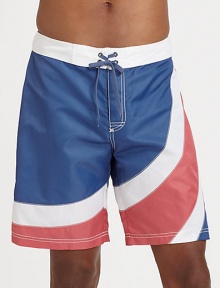 A summer favorite, for the beach and beyond, brightly designed in quick-drying nylon for maximum comfort and support.Drawstring tie waistBack flap pocketInseam, about 9NylonMachine washImported