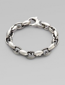 Alternating oval and thorn links in polished sterling silver. About 9½ long Lobster clasp Imported